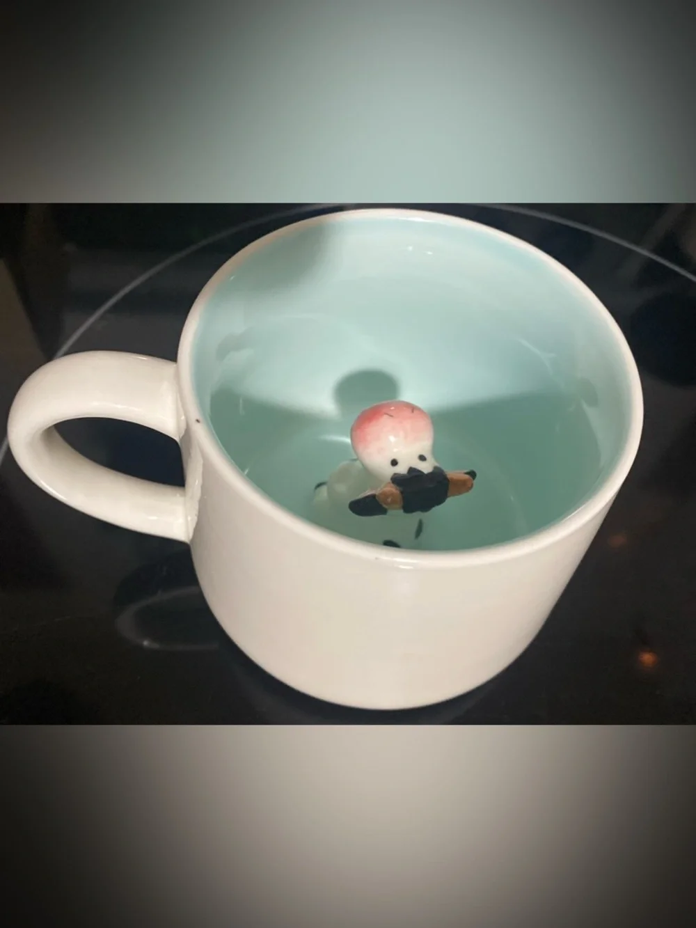 Peek-a-boo ceramic cow mug